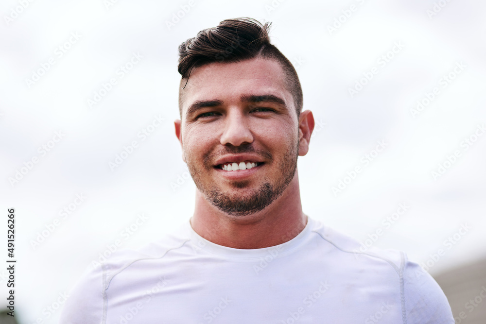 What a great day for a game of rugby. Portrait of a young man playing a game of rugby.