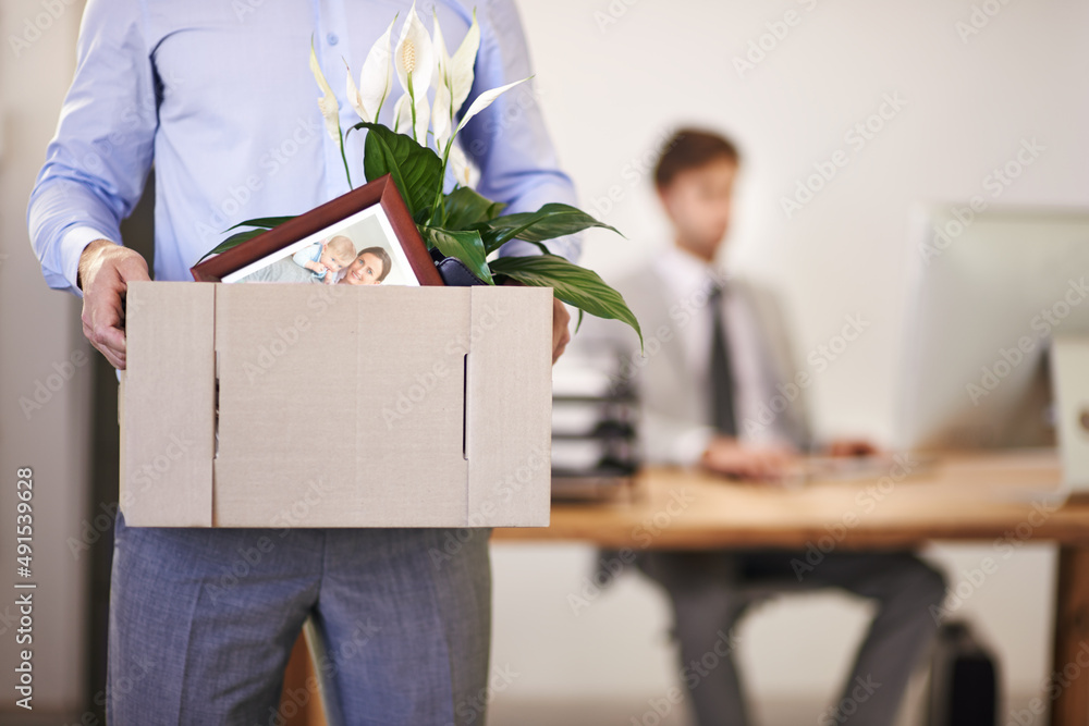 Make sure youre not replaceable. Cropped shot of a businessman leaving work as hes being replaced by