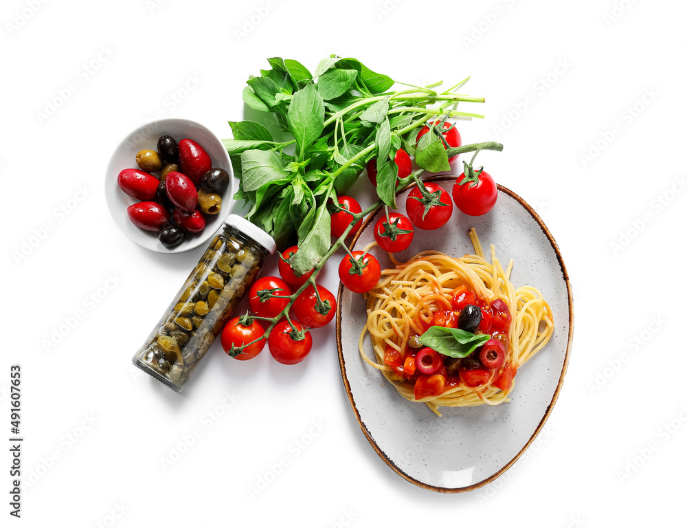 Plate with tasty Pasta Puttanesca and ingredients on white background