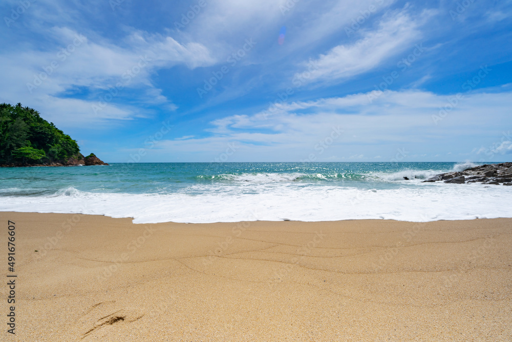 Tropical sandy beach at Phuket Thailand with blue ocean and blue sky background image for nature bac