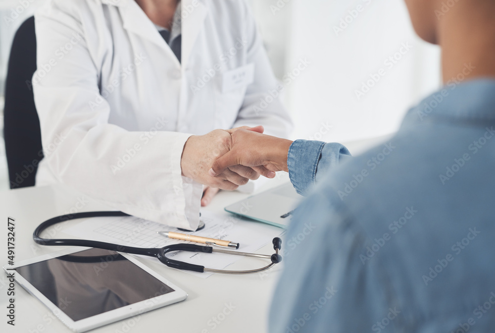 Congratulations on your recovery. Cropped shot of an unrecognizable female doctor shaking hands with