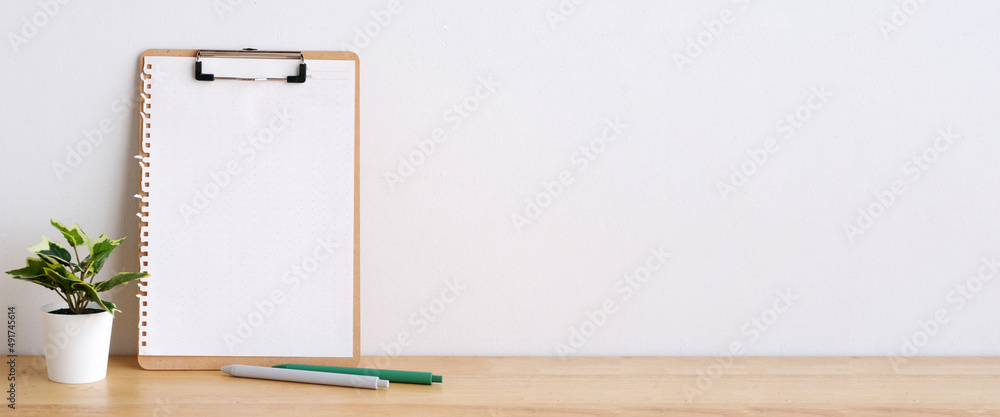 Blank notebook paper on white table background