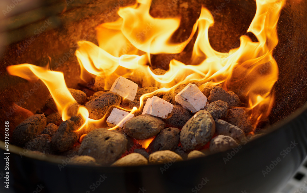 Fireside fun. Closeup of a warm fire burning in a barbeque.