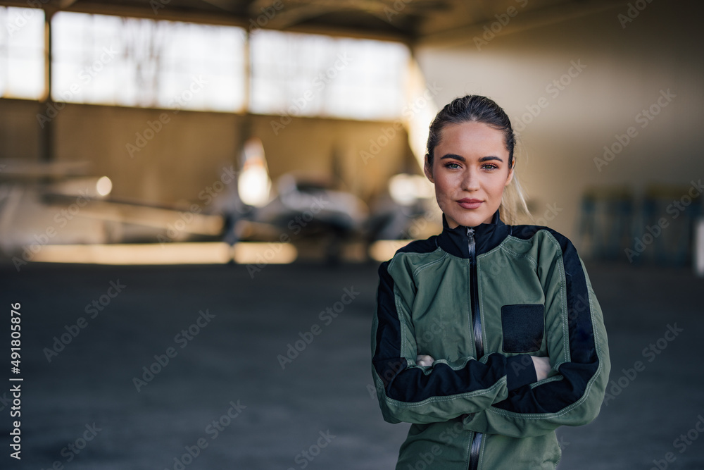 Portrait of a pretty girl, in a pilot suit.