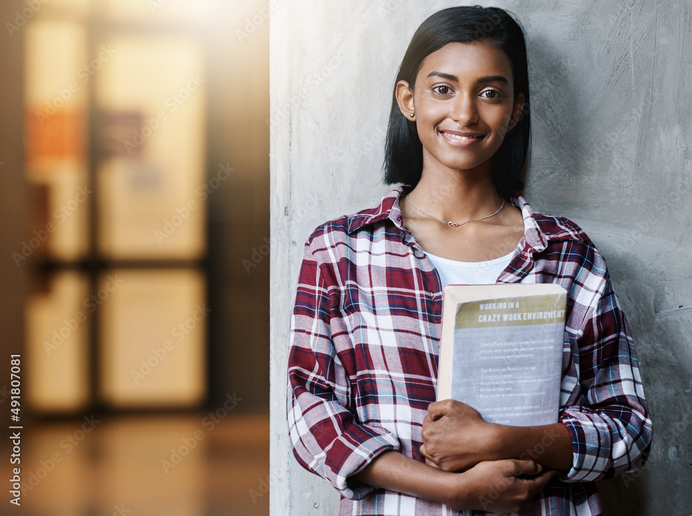 Im looking forward to my first class. Cropped portrait of an attractive young female student standin