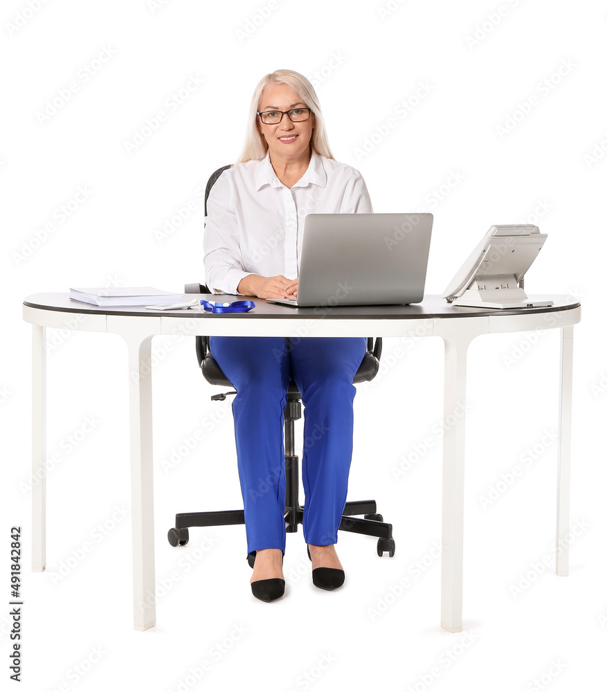 Mature secretary at table on white background