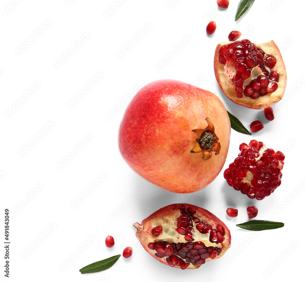 Tasty ripe pomegranates on white background