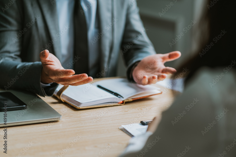 Asian male director is interviewing to recruit new employees