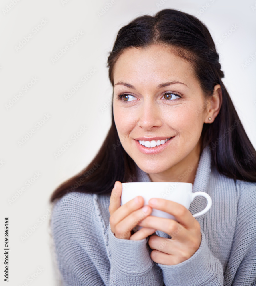 I have a feeling its going to be a good day.... Cropped shot of a beautiful young woman enjoying a c