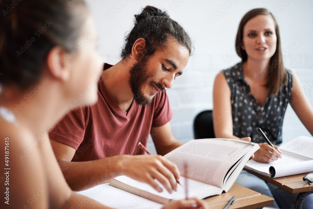 Theyre showing a dedication to education. Cropped shot of young college students in class.