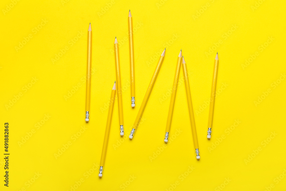 Ordinary pencils on yellow background