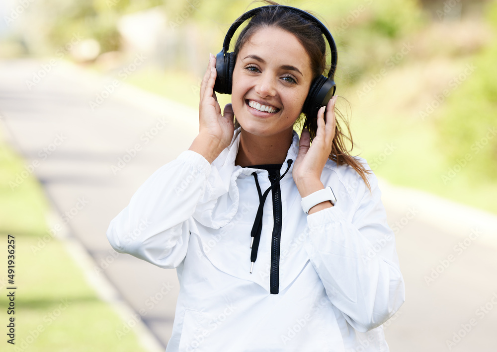 Find your track and run to it. Cropped portrait of an attractive and athletic young woman listening 