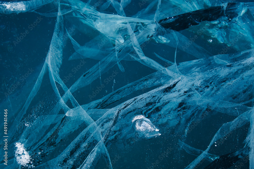 Texture of winter ice surface. Blue natural ice background