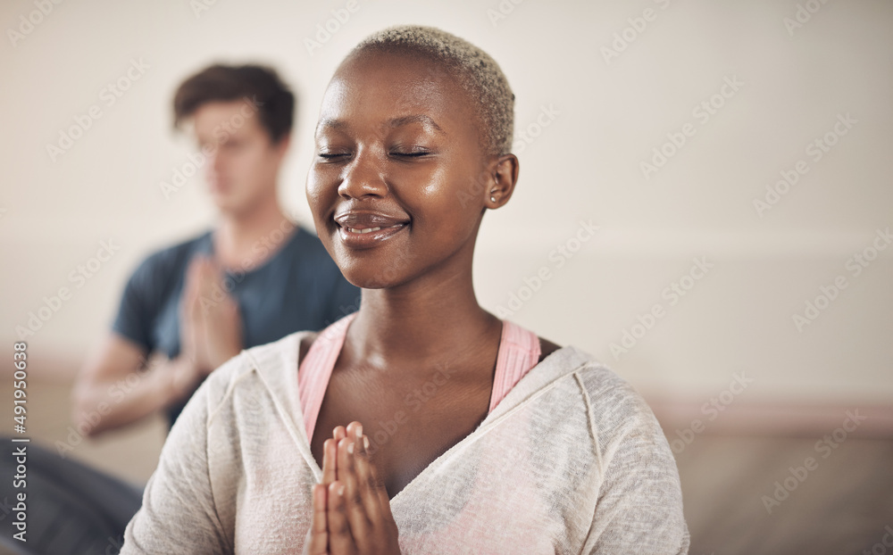 Meditation is both the means and the end. Cropped shot of an attractive young woman sitting and medi