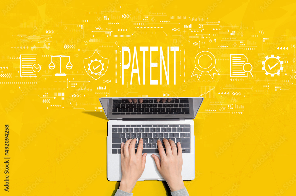 Patent concept with person using a laptop computer