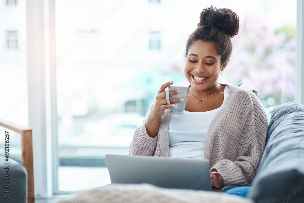 Saturdays are for some online time with your friends. Cropped shot of an attractive young woman usin