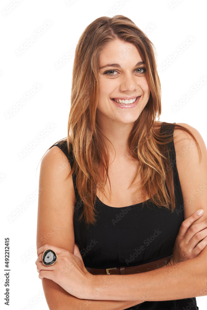 Casually confident. Studio shot of an attractive young woman in a dress isolated on white.