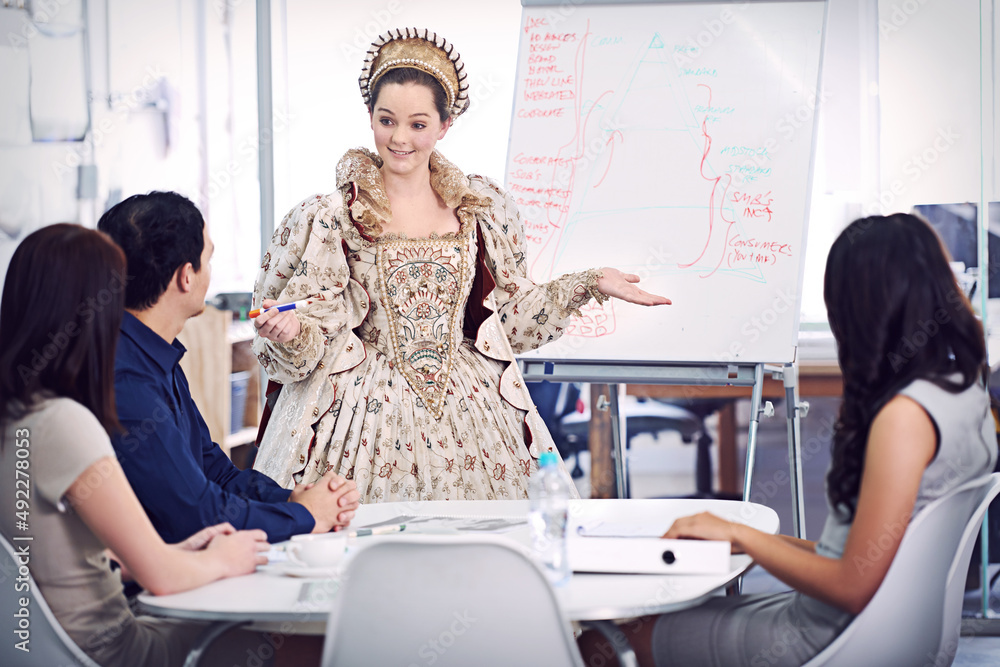 Bringing her reign to the office. A queen giving a presentation to her staff.