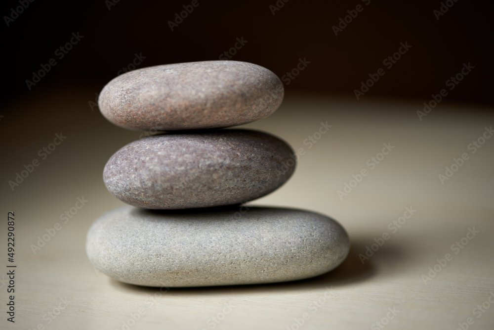 Zen balance. Three stones balanced on top of each other in natural light.