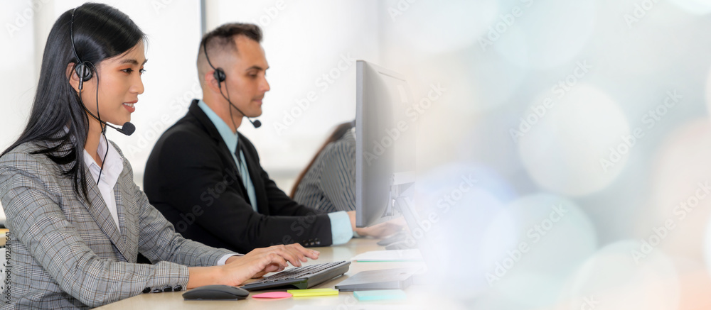 Business people wearing headset working in office to support remote customer or colleague. Call cent