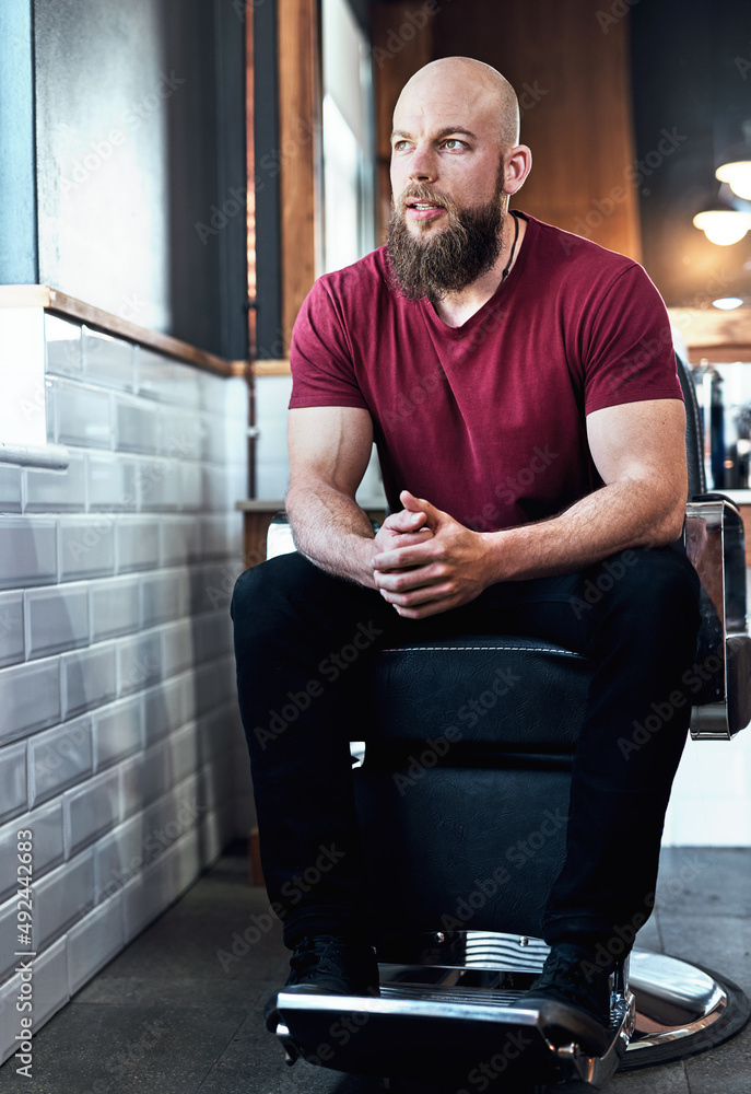 Its always more than just a haircut. Full length shot of a handsome young barber sitting on a chair 