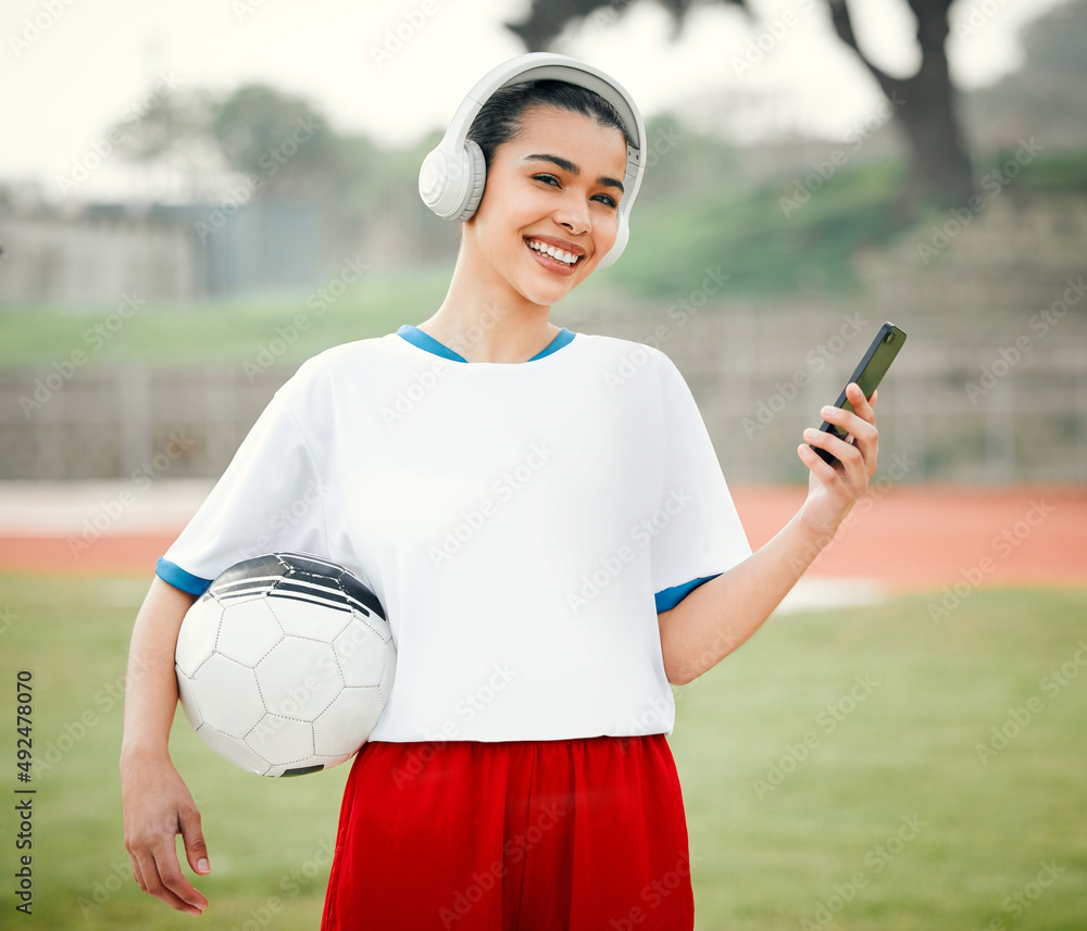 Pre-game prep. Cropped portrait of an attractive young female footballer standing outside with a soc