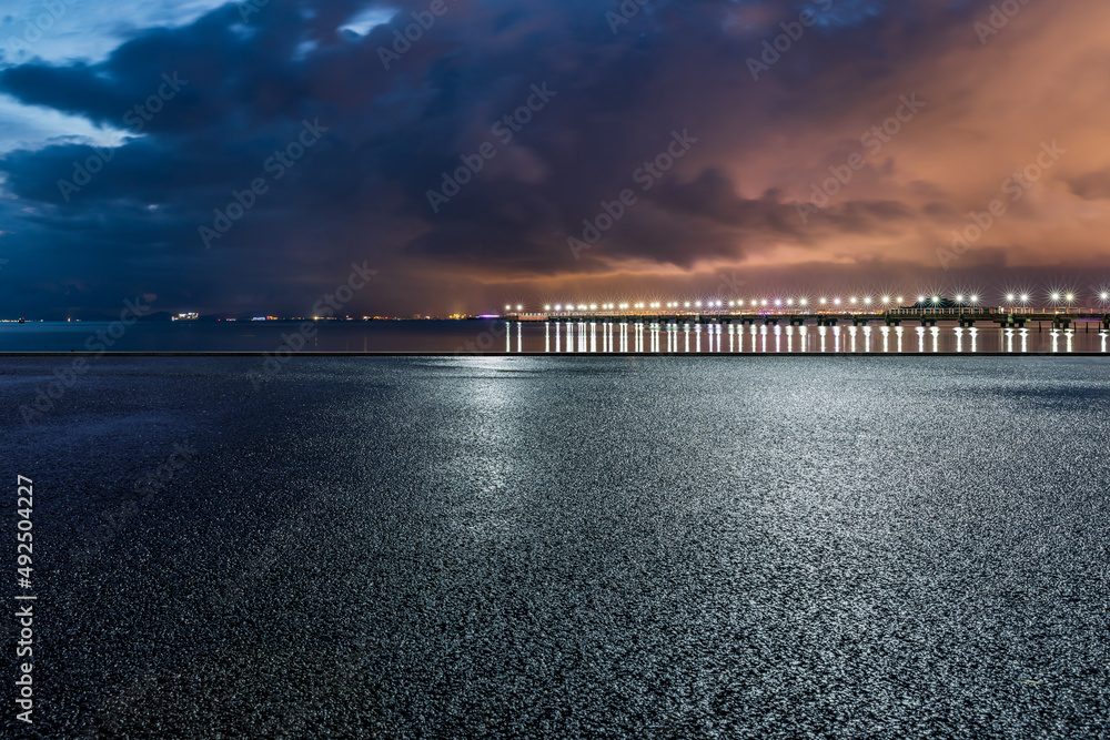 Empty asphalt road platform and clouds scenery at night