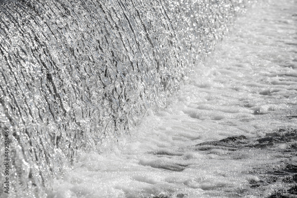 Water dam, waterfall, early spring nature.