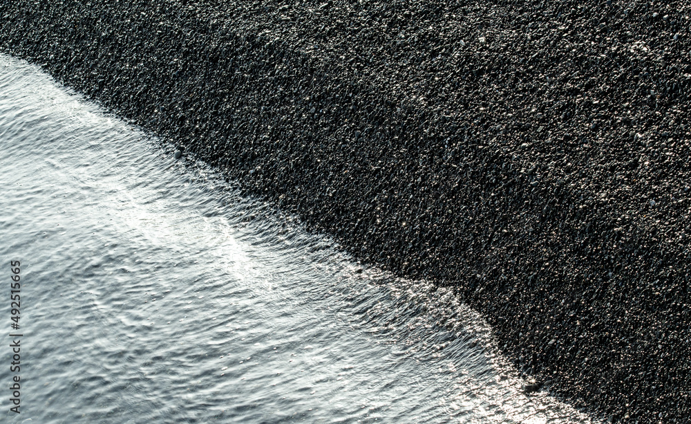 Sea pebble stones, background texture.