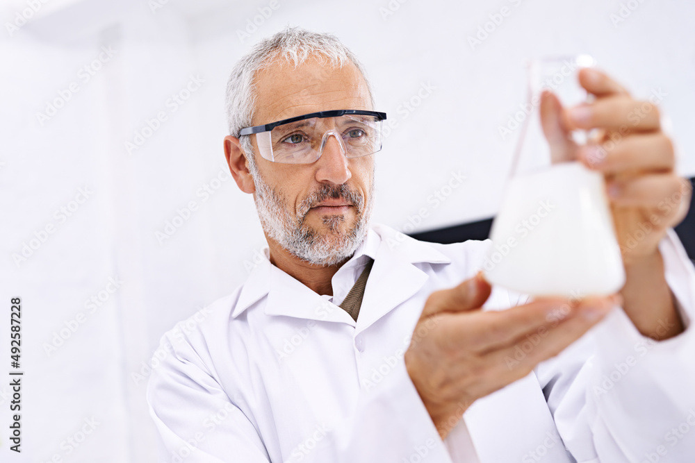 The results are conclusive. Shot of a mature male scientist examining the results of an experiment i