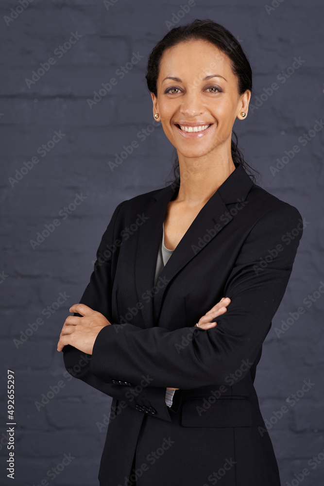 Shes the best in the business. Portrait of a confident businesswoman standing with her arms crossed.