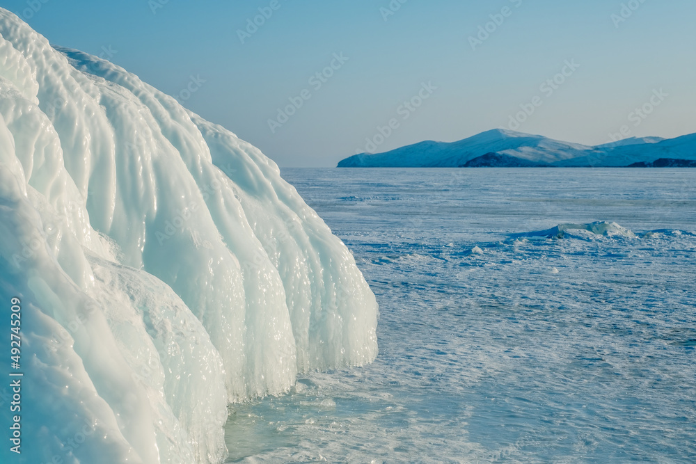 Ice and icicles on rocks on Lake Baikal