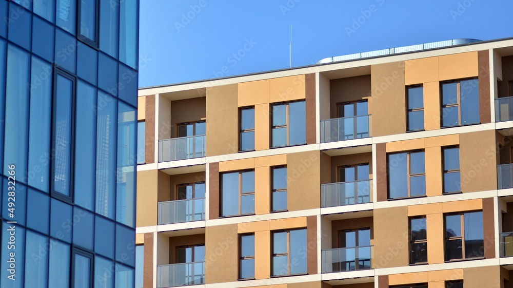 A residential building and an adjacent office building. Modern urban development.