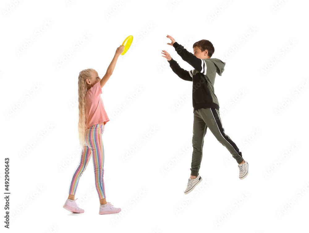 Funny children playing frisbee on white background