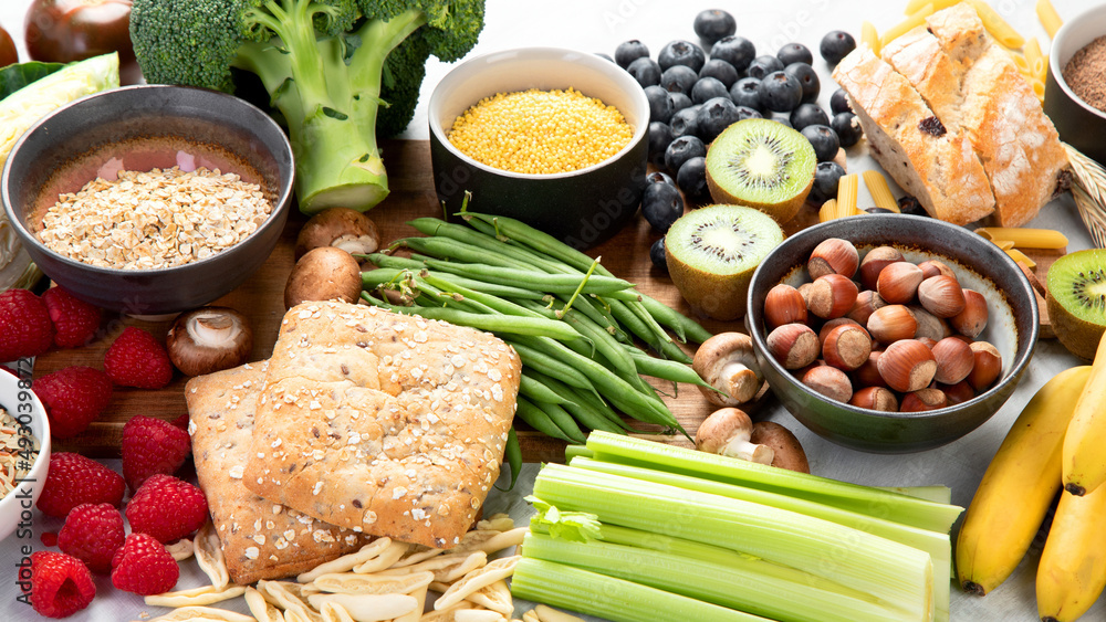 Foods high in fiber on gray background.