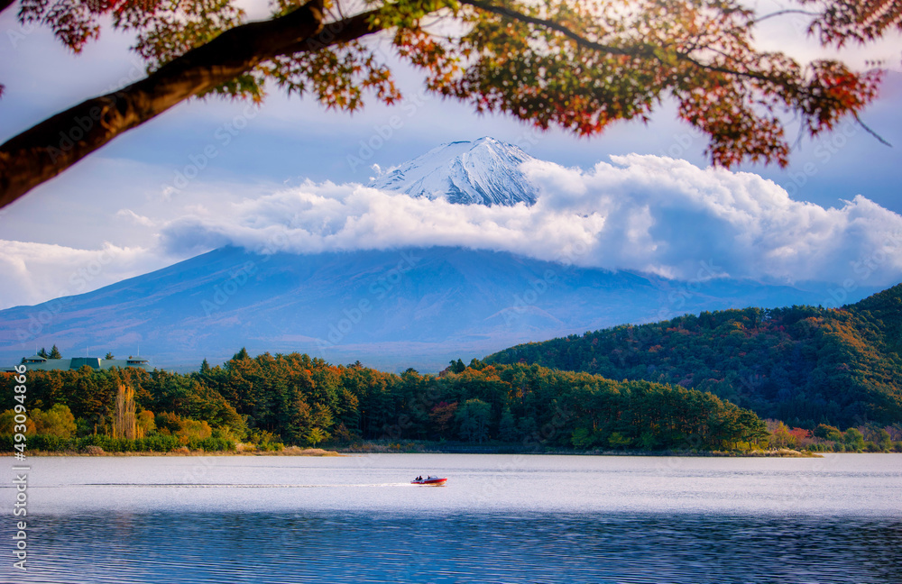 Landscape image of Mt. Fuji over Lake Kawaguchiko with autumn foliage at daytime in Fujikawaguchiko,