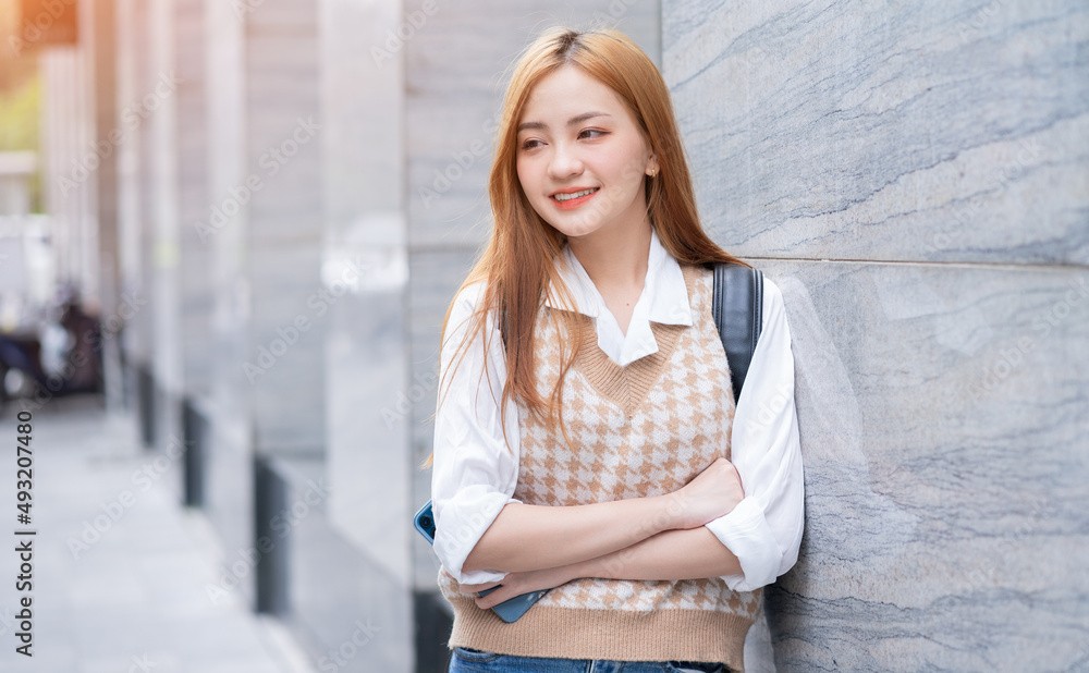 Image of young Asian woman on street