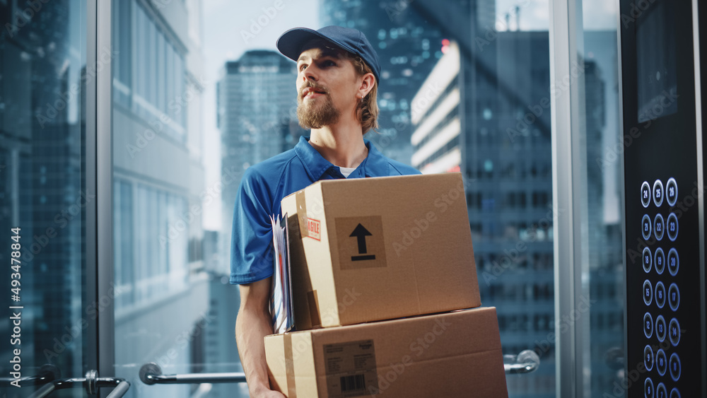 Young Delivery Person Riding Glass Elevator in Modern Office Building. Mail Courier Holding Cardboar