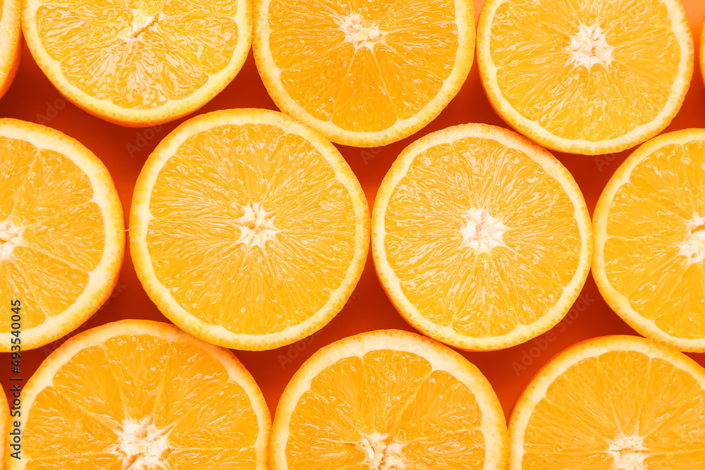 Slices of juicy orange as background, closeup