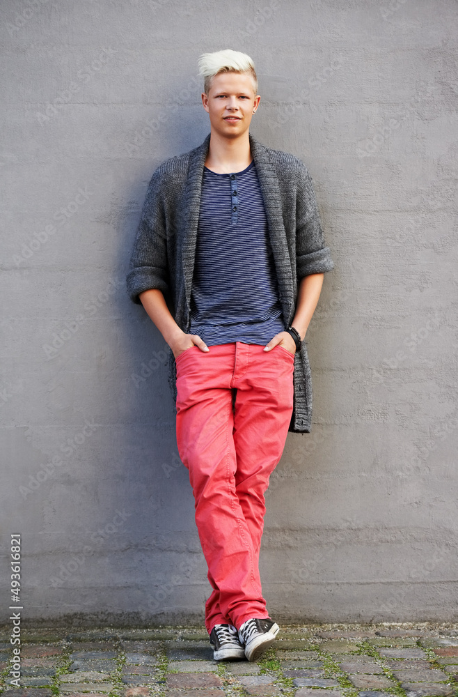 Hipster style. Full length shot a handsome and fashionable young man standing outside with his hands