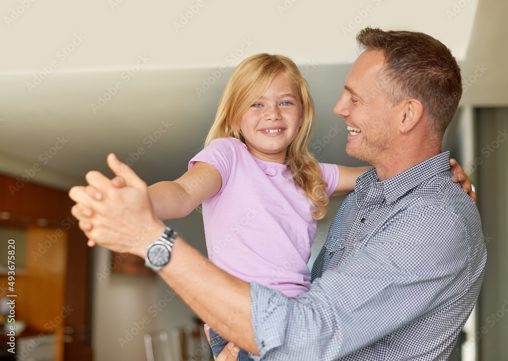 Dancing with Dad. Portrait of a father and daughter enjoying a dance together.