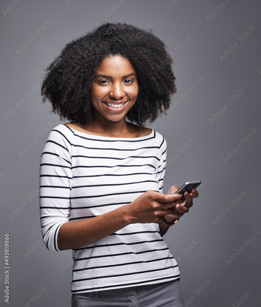 Need to talk to someone Catch me on my mobile. Studio portrait of a young woman using a mobile phone