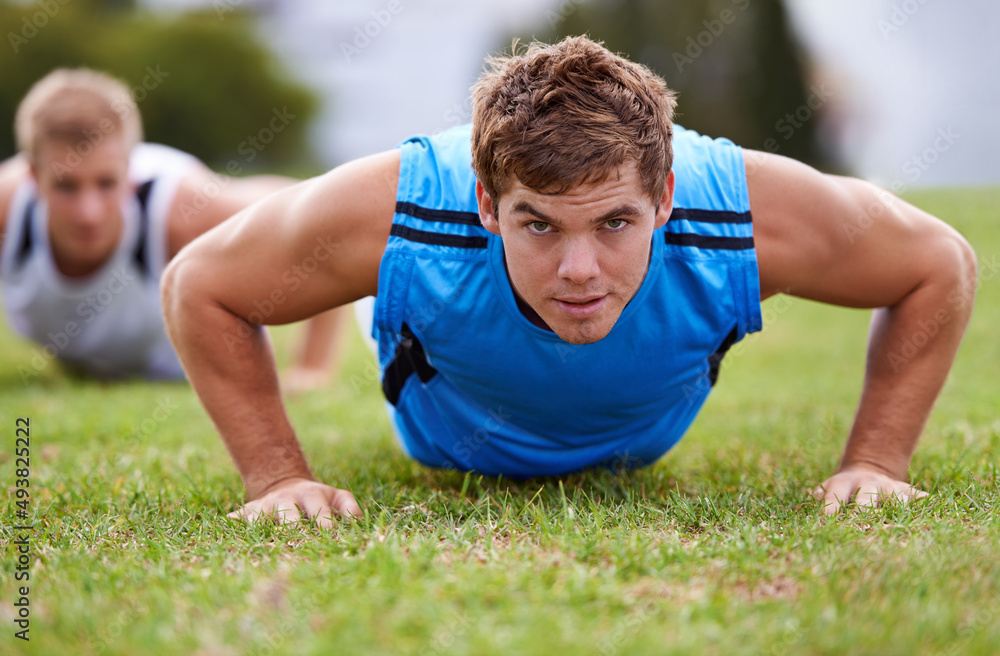 In the business of fitness. Closeup shot of a young man doing push-ups.