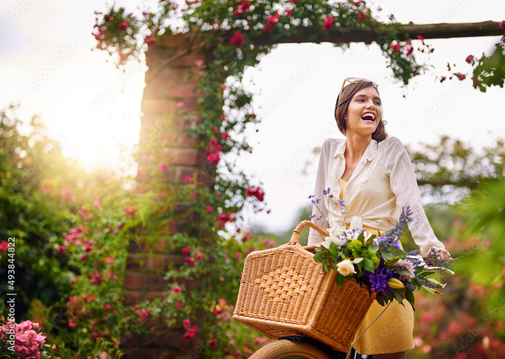 In nature is where she loves to be. Shot of an attractive young woman riding a bicycle outdoors.