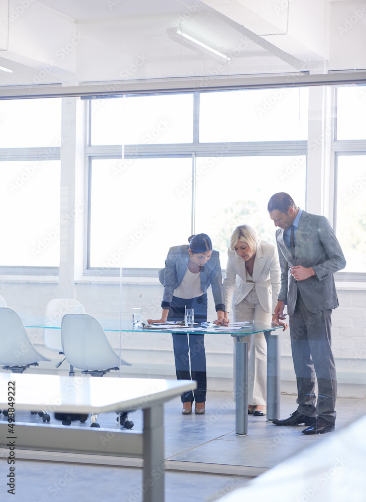 Getting their input on a new project. Cropped shot of a group of business colleagues meeting in the 