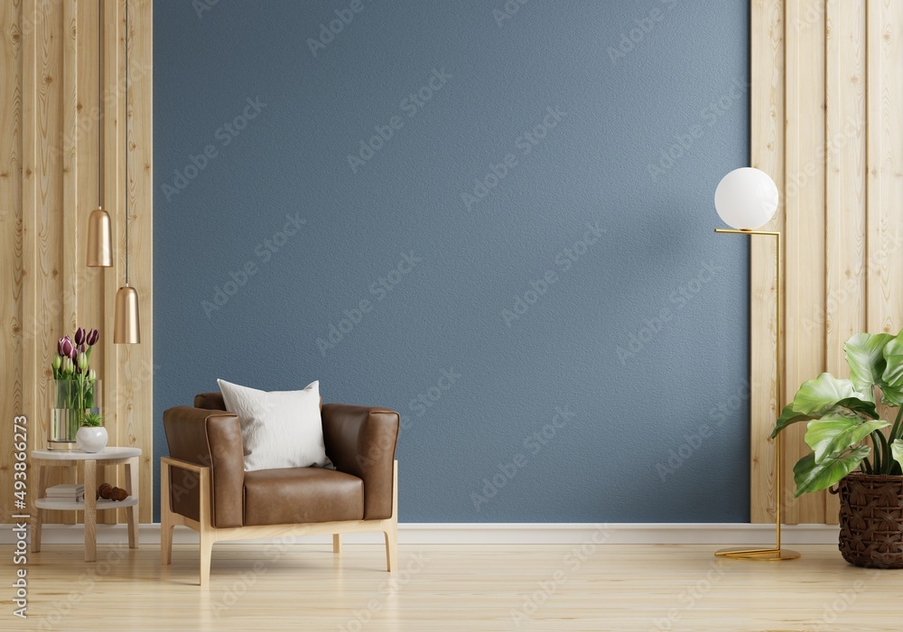 Armchair on empty dark blue wall background.