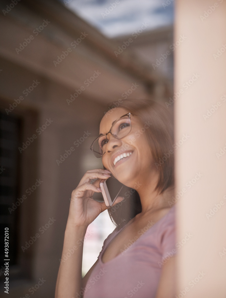 Connecting with clients from the comfort of her home. Cropped shot of an attractive young woman on a