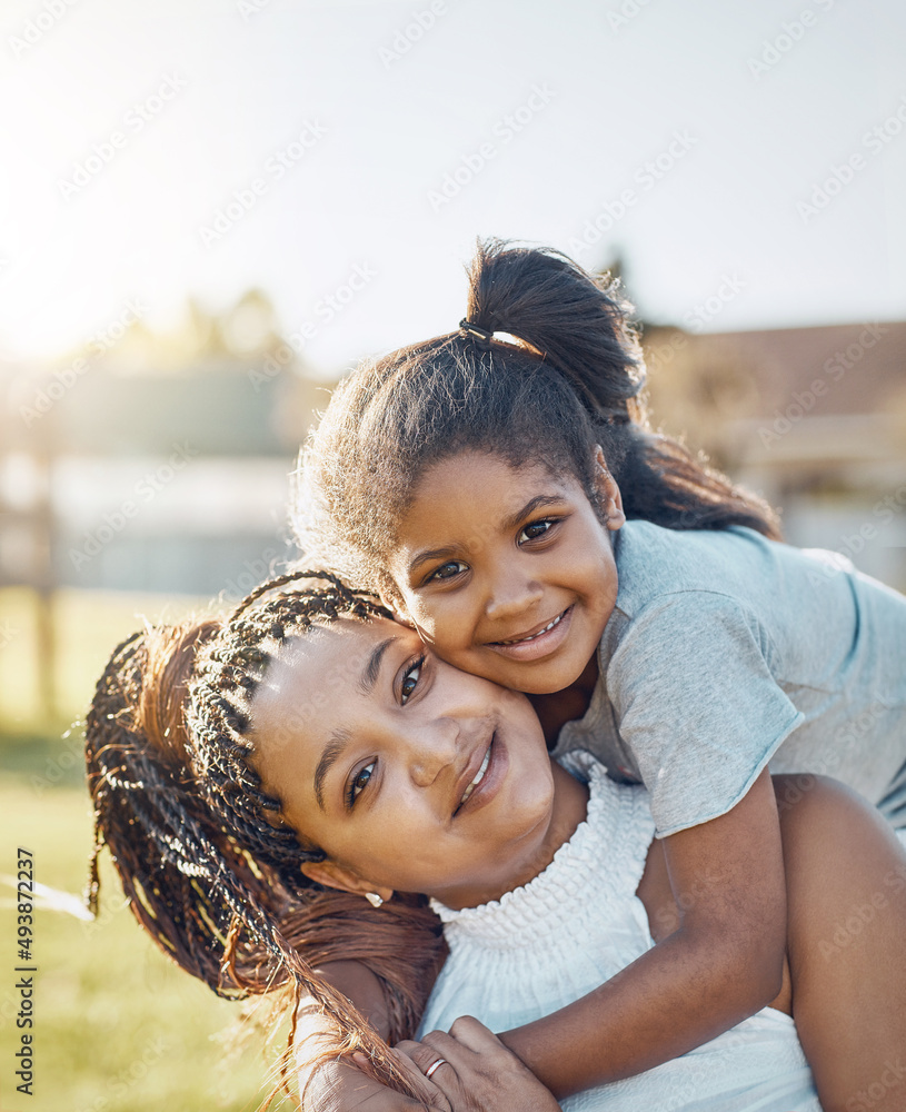 Their bond is sealed by a love like no other. Portrait of a mother bonding with her daughter outdoor