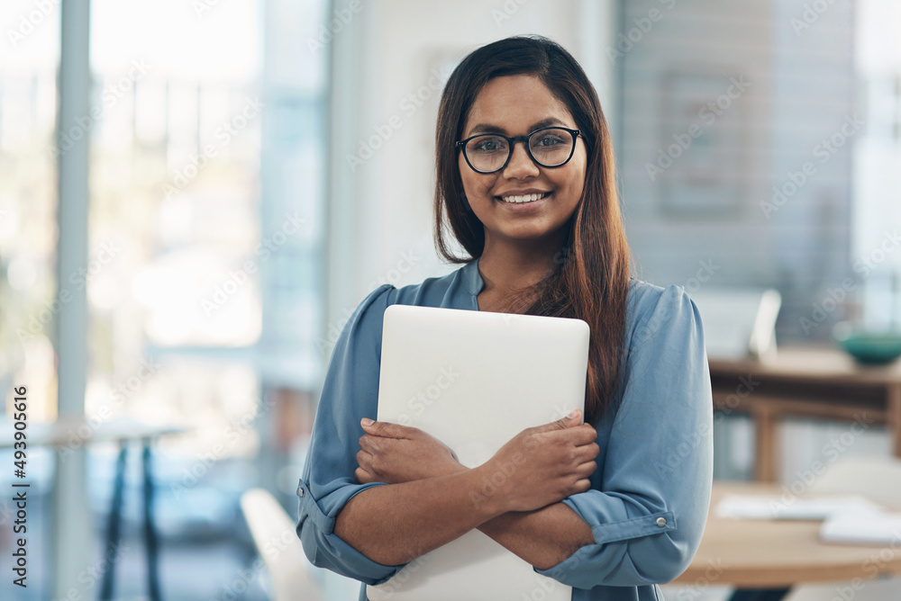 Im excited to explore new opportunities today. Portrait of a young businesswoman holding a laptop wh