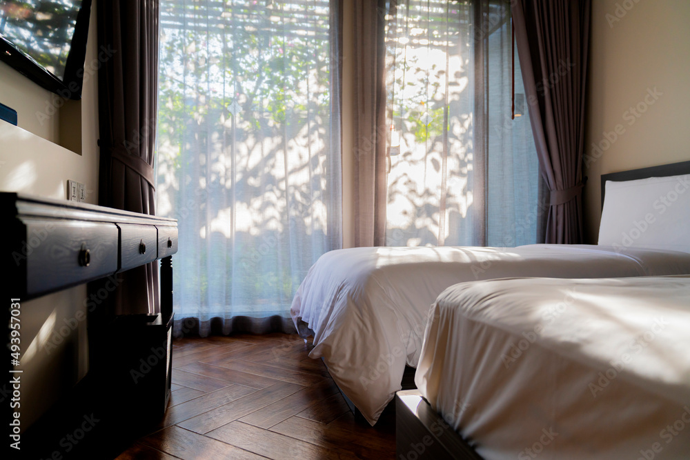 bedroom interior detail design,white soft mattress with wooden floor and old style cabinet morning s